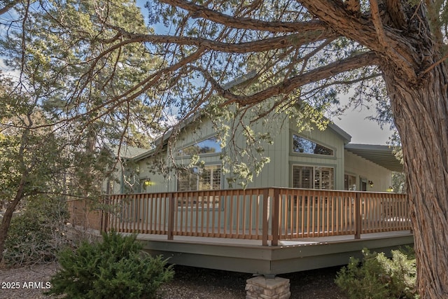 rear view of house featuring a deck