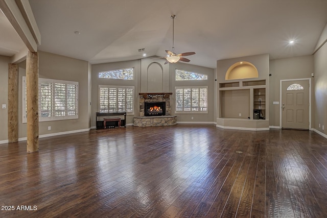 unfurnished living room featuring ceiling fan, high vaulted ceiling, dark hardwood / wood-style floors, and a fireplace