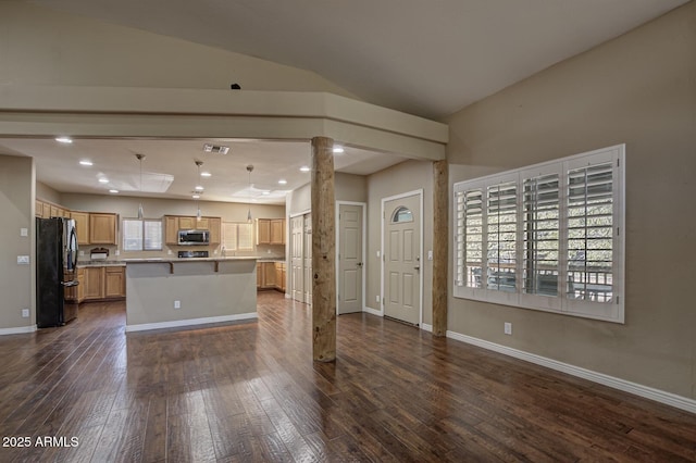 unfurnished living room with lofted ceiling, dark wood-type flooring, and sink