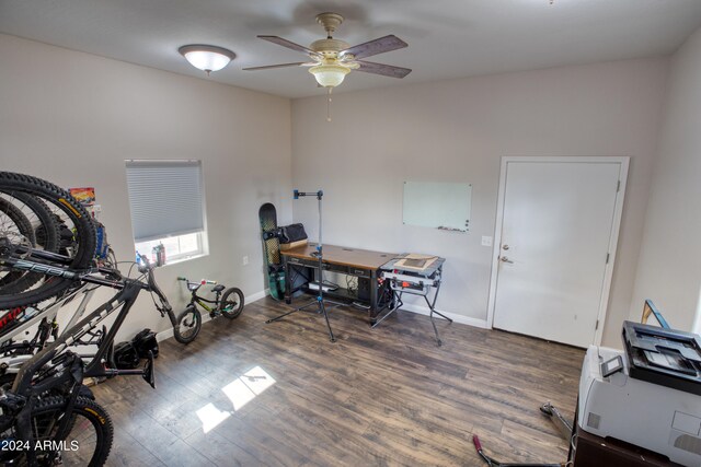 office with ceiling fan and dark hardwood / wood-style flooring