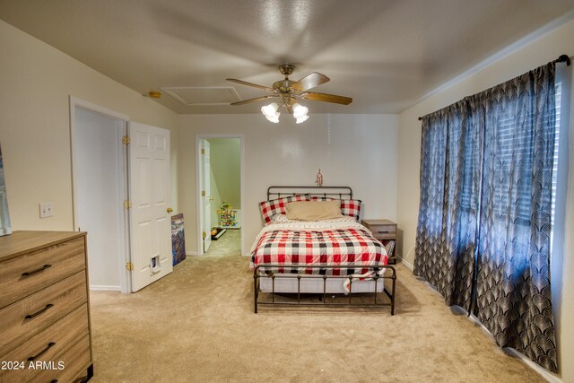 bedroom featuring ceiling fan and light colored carpet