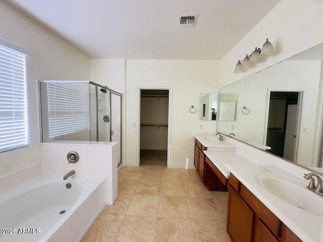 bathroom featuring independent shower and bath and vanity