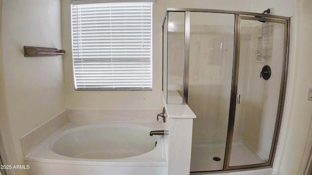 bathroom with separate shower and tub