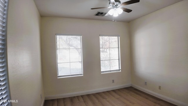 unfurnished room with wood-type flooring and ceiling fan