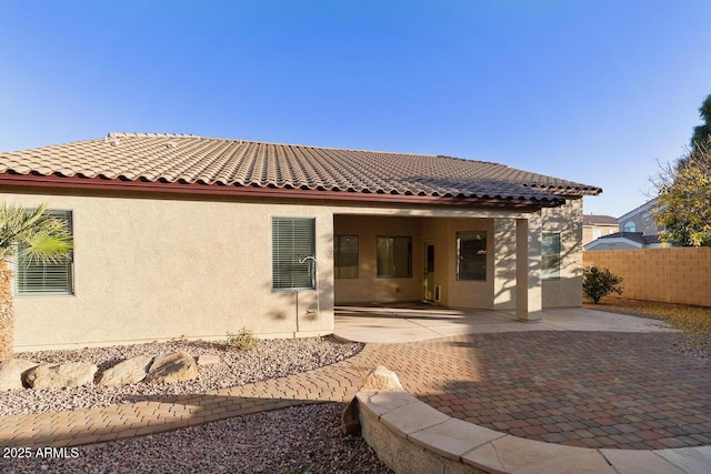 rear view of house with a patio