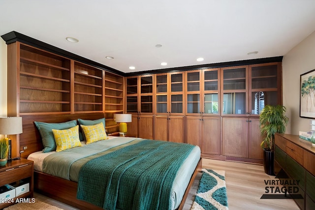 bedroom with light hardwood / wood-style floors