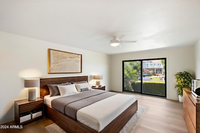 bedroom with access to outside, ceiling fan, and light wood-type flooring