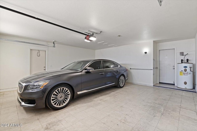 garage with a garage door opener and water heater