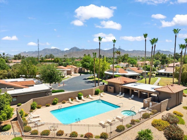 view of pool with a mountain view and a patio area