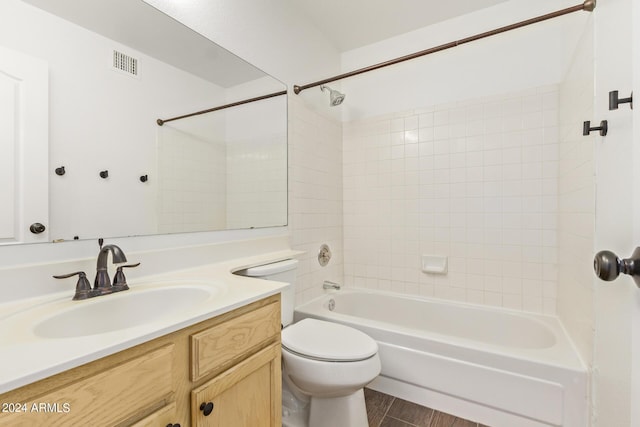 full bathroom with toilet, visible vents, bathing tub / shower combination, and vanity