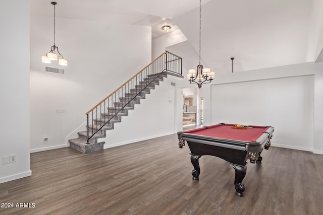 game room with baseboards, high vaulted ceiling, visible vents, and wood finished floors