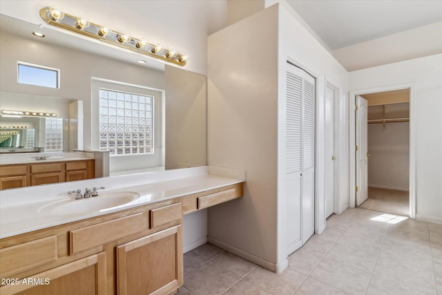 bathroom with tile patterned flooring and vanity