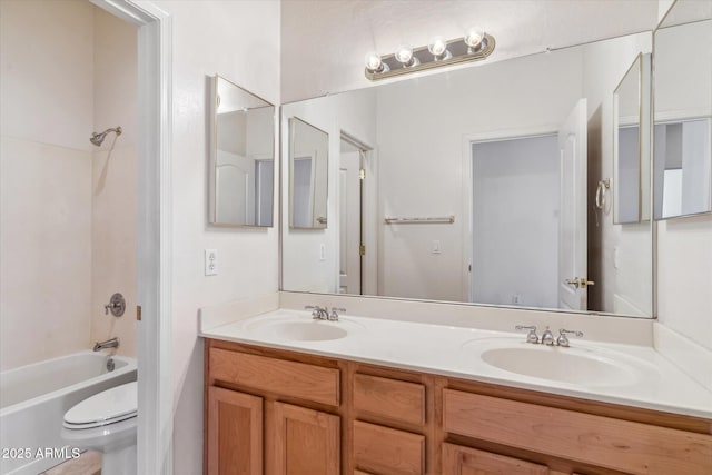 full bathroom featuring vanity, toilet, and shower / washtub combination