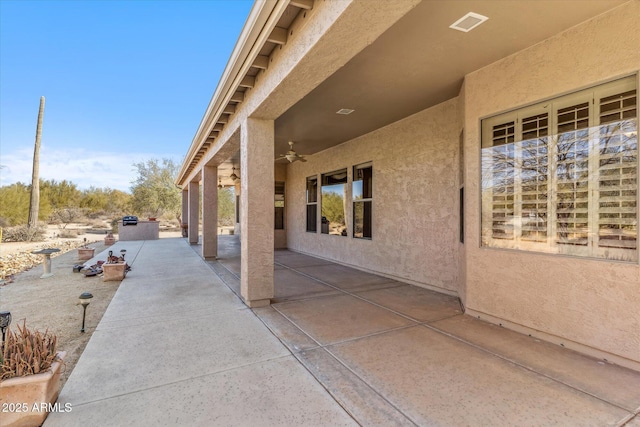 view of patio / terrace featuring ceiling fan