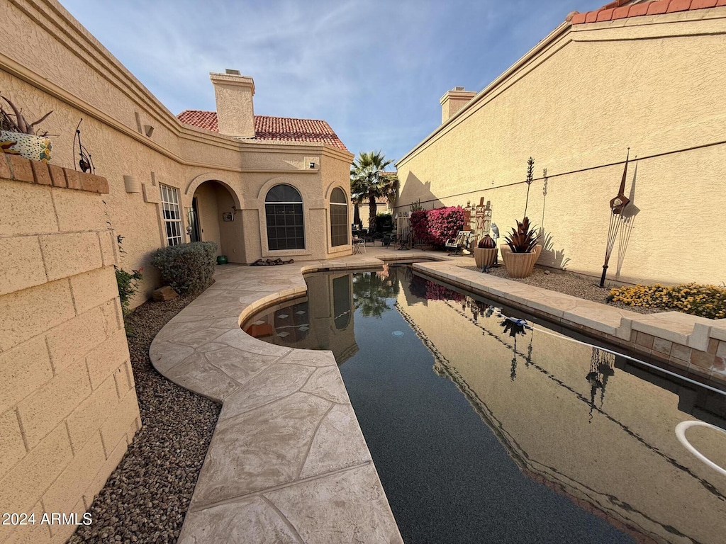 view of swimming pool with a patio