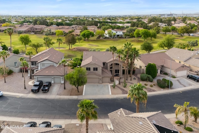 aerial view with golf course view and a residential view