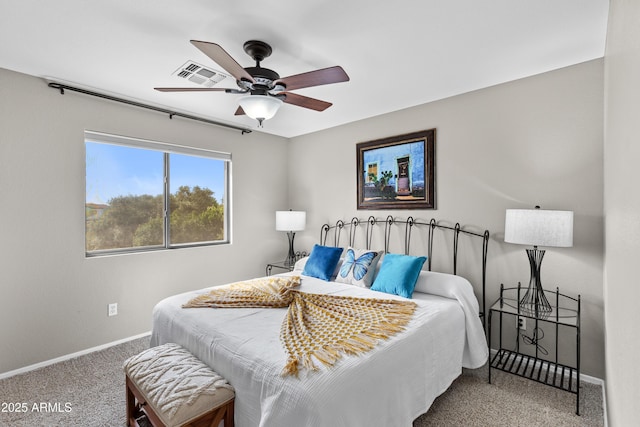 bedroom with visible vents, baseboards, a ceiling fan, and carpet flooring