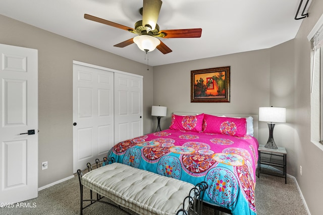 bedroom featuring a closet, baseboards, ceiling fan, and carpet