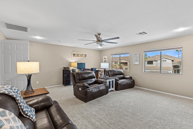home theater featuring visible vents, baseboards, a ceiling fan, and carpet floors