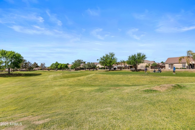 view of yard featuring a residential view and view of golf course
