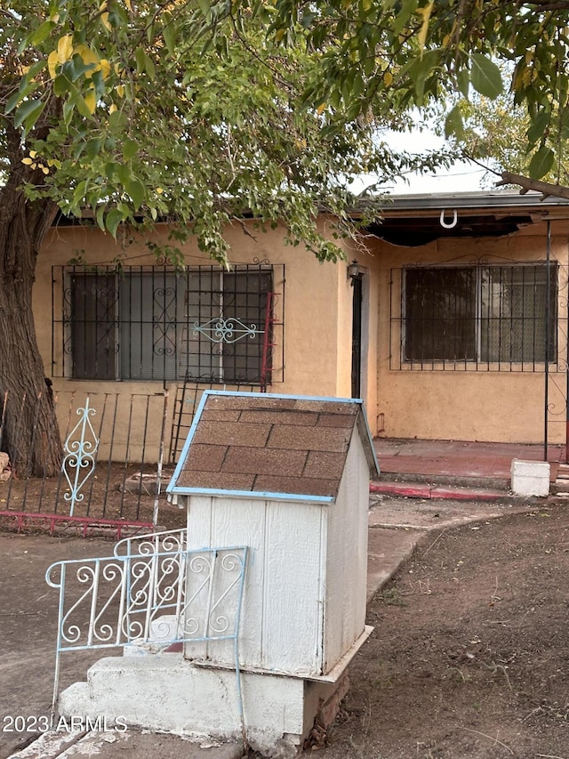 313 E 16th St, Douglas, AZ 85607 - doorway to property with stucco siding and a gate