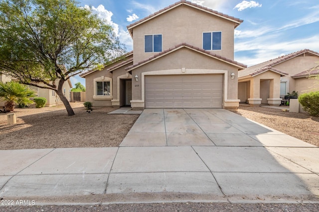 front of property with a garage