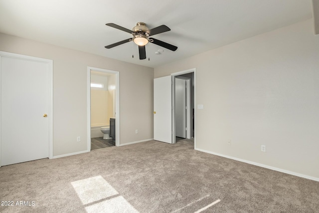 6537 W Riva Rd, Phoenix, AZ 85043 - unfurnished bedroom featuring ceiling fan, ensuite bathroom, and carpet flooring