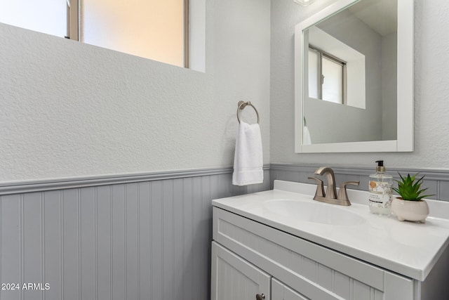 bathroom featuring plenty of natural light and vanity