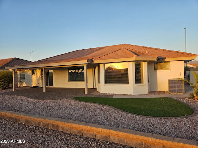 back of house with cooling unit and a patio area