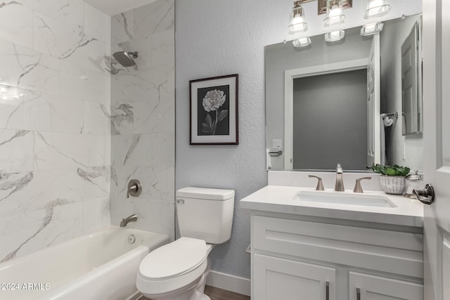 full bathroom featuring tiled shower / bath, toilet, vanity, and wood-type flooring