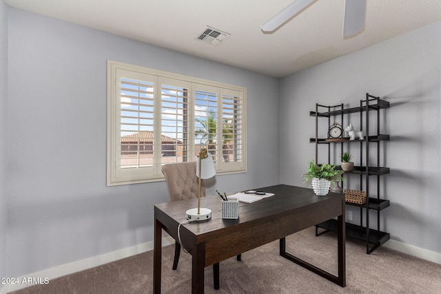 office with carpet flooring and ceiling fan