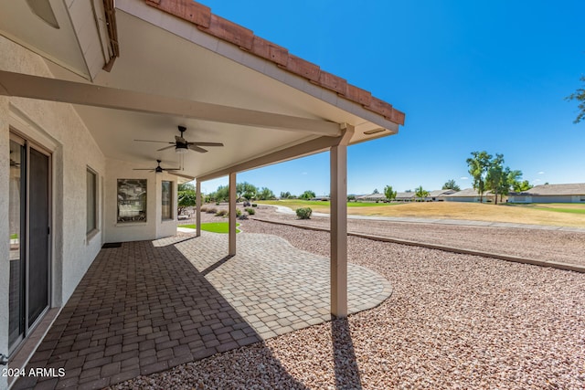 view of patio featuring ceiling fan