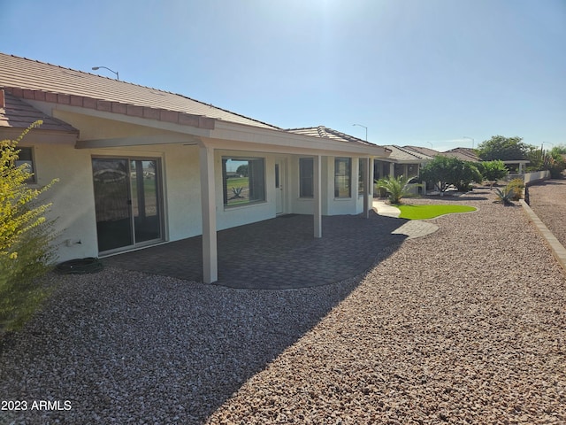 back of property featuring a patio area