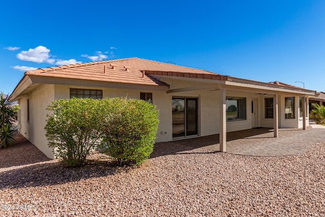 back of property with a patio area