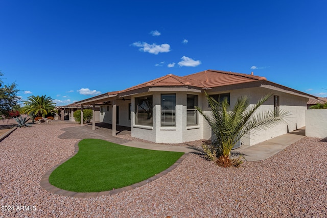 rear view of property with a patio area