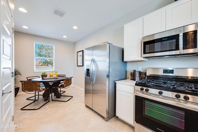 16762 W Alameda Rd, Surprise, AZ 85387 - kitchen with appliances with stainless steel finishes, white cabinetry, recessed lighting, light countertops, and light tile patterned floors