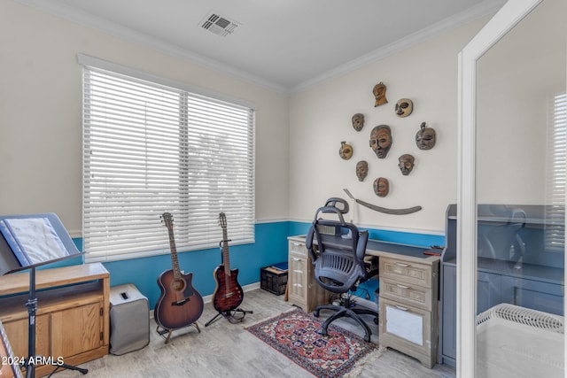 office with crown molding and light hardwood / wood-style floors