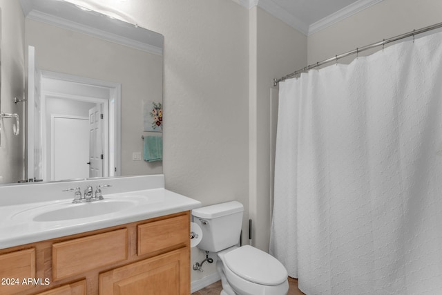 bathroom featuring oversized vanity, toilet, and ornamental molding