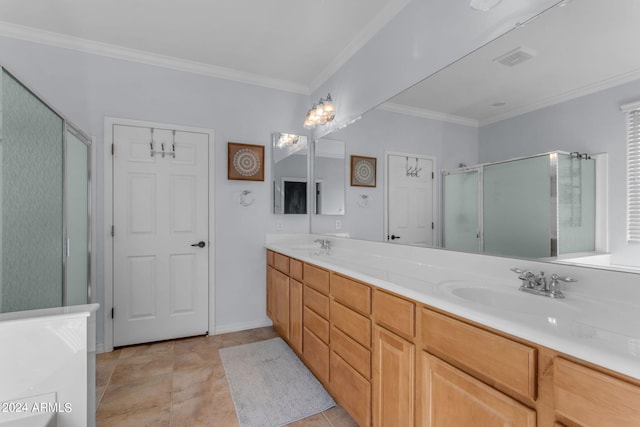 bathroom featuring double sink, a shower with shower door, tile floors, vanity with extensive cabinet space, and crown molding