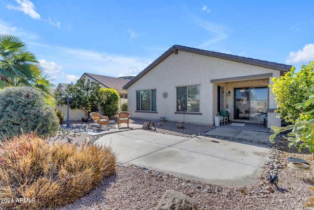 rear view of house featuring a patio area