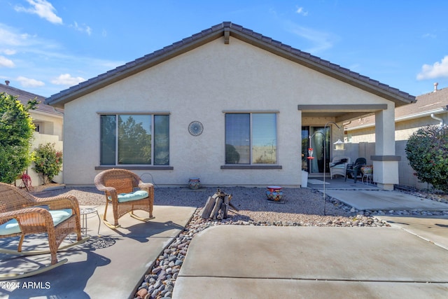 rear view of house with a patio