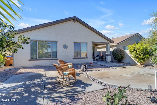 rear view of house with a patio