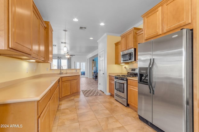 kitchen featuring ceiling fan, light tile floors, sink, crown molding, and appliances with stainless steel finishes