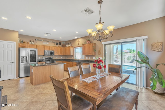 209 N 237th Ave, Buckeye, AZ 85396 - dining space featuring a chandelier, recessed lighting, and light tile patterned floors