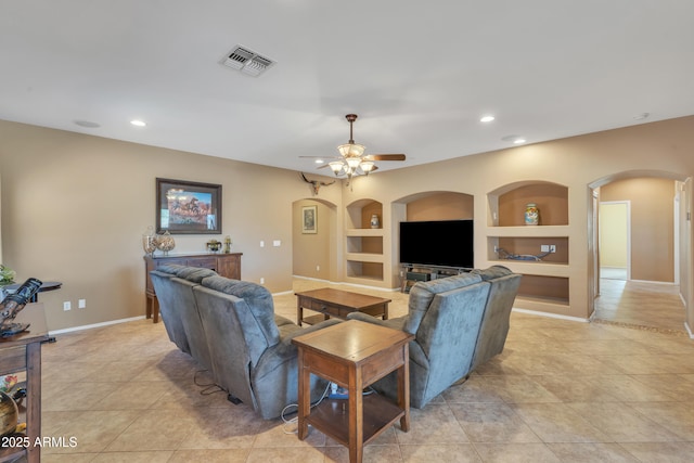209 N 237th Ave, Buckeye, AZ 85396 - living area with arched walkways, built in features, light tile patterned floors, a ceiling fan, and recessed lighting