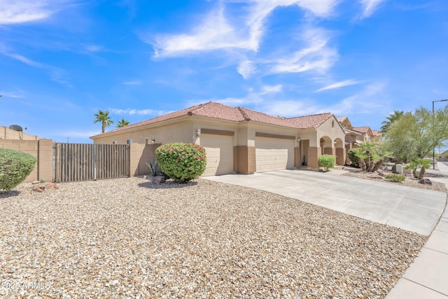 209 N 237th Ave, Buckeye, AZ 85396 - view of front of home featuring an attached garage, stucco siding, concrete driveway, and a tile roof