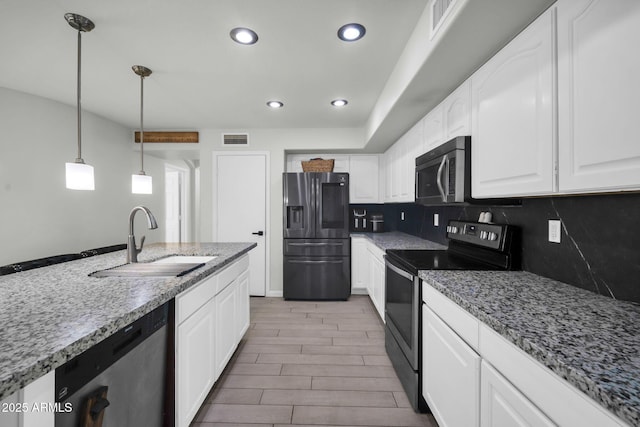 kitchen featuring a sink, white cabinets, and stainless steel appliances