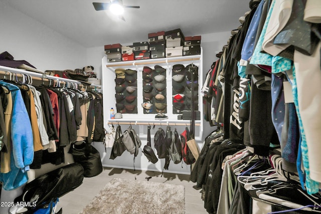 walk in closet with ceiling fan