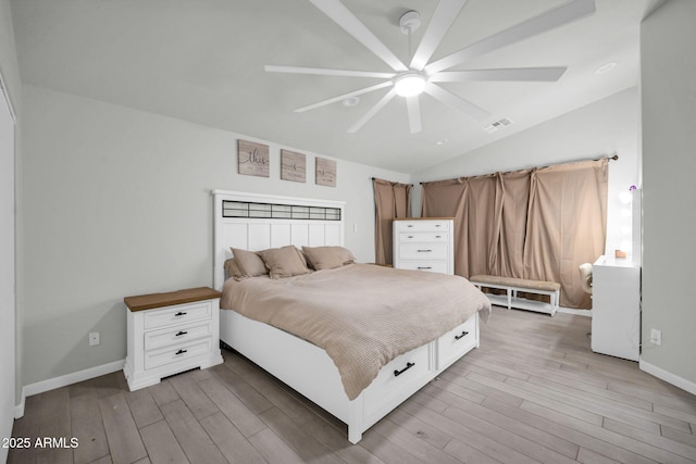 bedroom with ceiling fan, light wood-style floors, baseboards, lofted ceiling, and visible vents