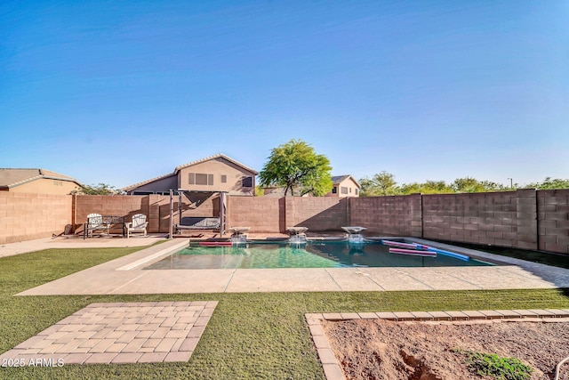 view of swimming pool with a fenced backyard, a fenced in pool, a yard, and a patio